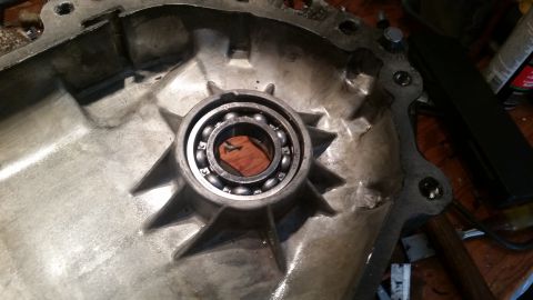 1985 Ford Bronco - A close-up view shows a bearing installed in a metallic component, likely part of a vehicle's transmission or drivetrain. The component has…