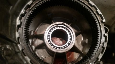 1985 Ford Bronco - A close-up view shows the internal components of a transmission, including a ring gear and a bearing assembly with visible ball bearings. R…