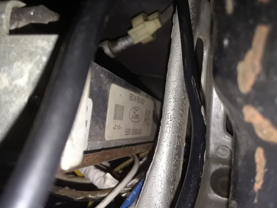 Ford ECM labeled EEC-IV, part number F5DF-12A650-GA, with Ford logo.