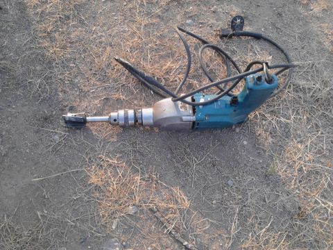 1995 Ford Bronco - Tool is an electric drill with a hole saw attachment, not a 1995 Ford Bronco.