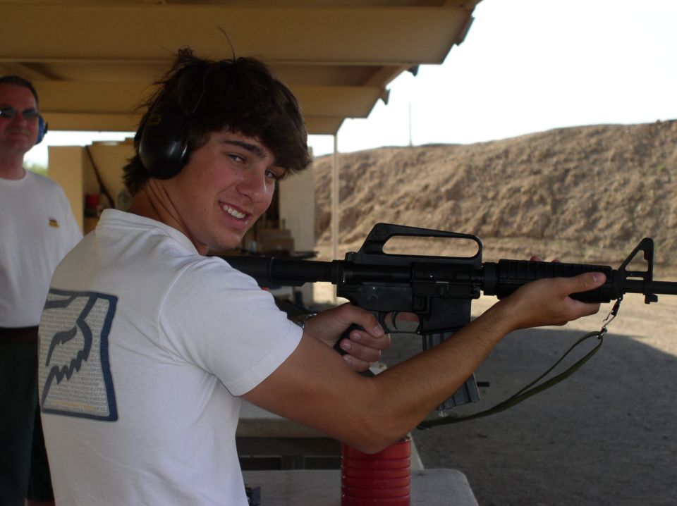 Person with rifle at shooting range