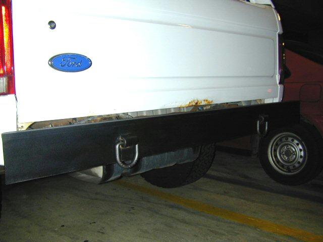 White 1995 Ford Bronco rear with flatbed and spare tire