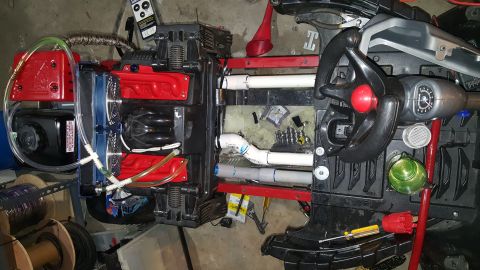 2007 Subaru Impreza - Customized toy vehicle interior features a steering wheel, dashboard, and added tubing and red components.
