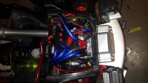 2007 Subaru Impreza - The image shows the interior of a vehicle's battery compartment, filled with various wires and components.