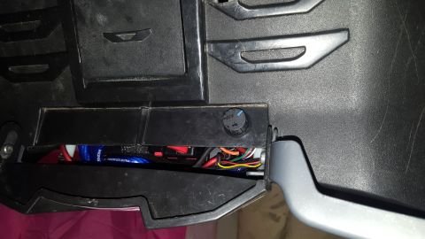 2007 Subaru Impreza - Exposed wiring and a control knob are visible within the car's interior panel.