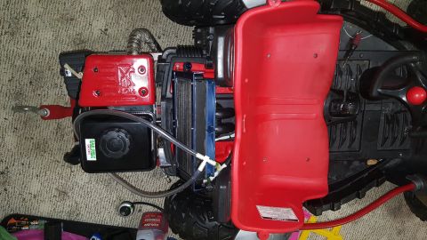 2007 Subaru Impreza - Overhead view of a toy vehicle's engine compartment, showing red plastic body parts and mechanical components.