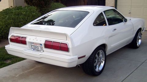 1978 Ford Mustang II - Rear view of a white 1978 Ford Mustang II, identified by its 'Cobra 78' license plate.