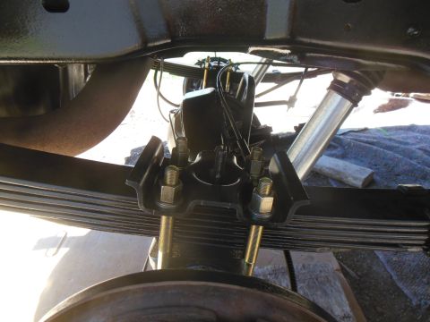 1984 Ford Bronco - stock leaf packs with an add a leaf,new spring bolts. bilstien 5100 in the background. all painted and installed!