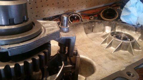 1985 Ford Bronco - A close-up view of the internal components of a manual transmission, showing gears, a shift fork, and part of the transmission housing. The…
