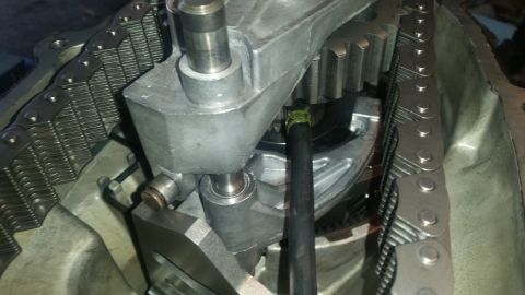 1985 Ford Bronco - A close-up view of the internal timing chain and gears of a vehicle engine.