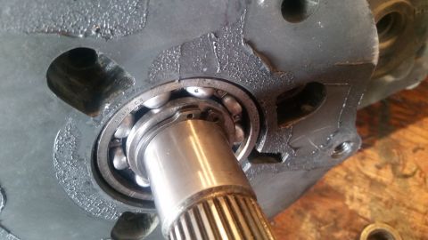 1985 Ford Bronco - A close-up view shows a ball bearing assembly with a splined shaft inserted into a dark metal housing. The bearing is marked with "6207 C3"…