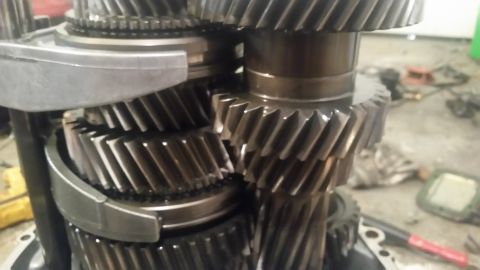 1985 Ford Bronco - This is a close-up, low-angle shot of the internal gears of a manual transmission. The gears appear to be made of metal and are arranged on…