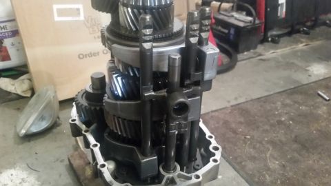 1985 Ford Bronco - A close-up view shows the internal components of a manual transmission, including gears, shafts, and shift forks. The transmission is parti…
