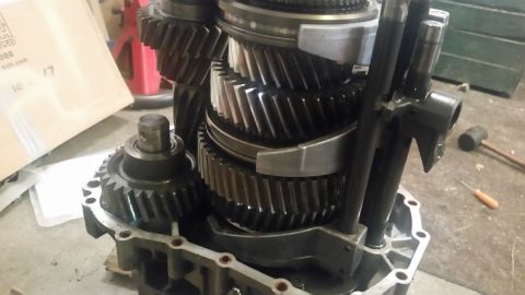 1985 Ford Bronco - A close-up view shows the internal gears and shafts of a manual transmission, likely from a 1985 Ford Bronco. The transmission is partially…