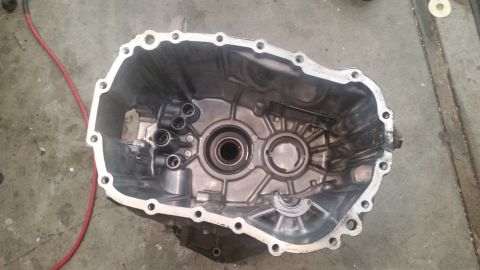 1985 Ford Bronco - This is a top-down view of the inside of an aluminum transmission case. The case is empty and shows internal components like bearings and m…