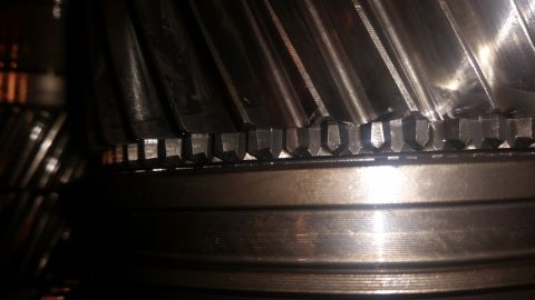 1985 Ford Bronco - Close-up view of the teeth of a metal gear set, likely from a transmission or differential. The gears are metallic with visible machining m…