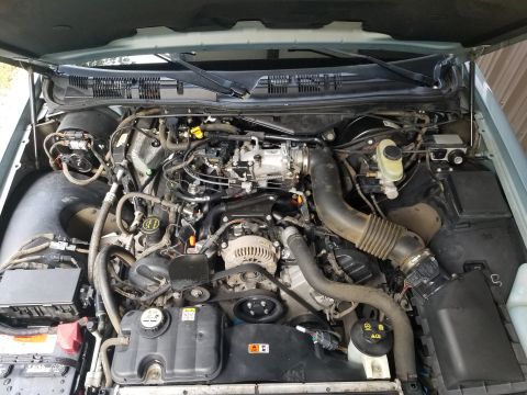 2004 Ford Crown Victoria - After a few cycles of garden hose & Purple Power/Dawn/water, it's clean enough to work on. Step one was drying all the spark plug wells, an…