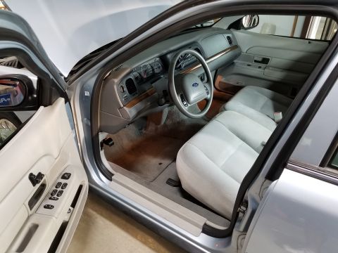 2004 Ford Crown Victoria - The interior is surprisingly clean, other than coffee spills on the dash cupholder.