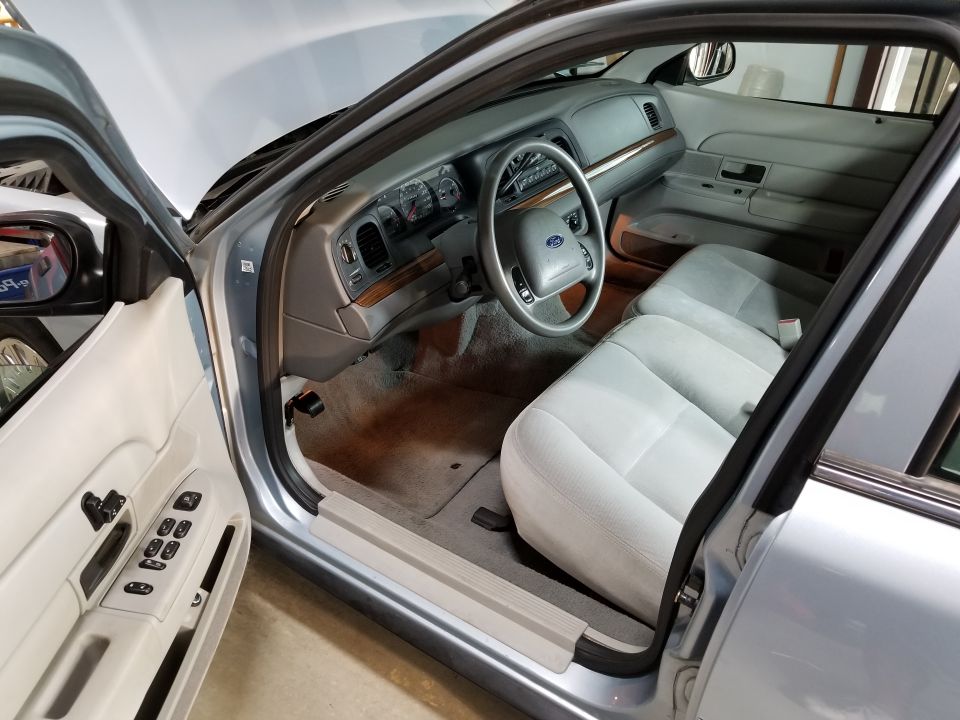 The interior is surprisingly clean, other than coffee spills on the dash cupholder.