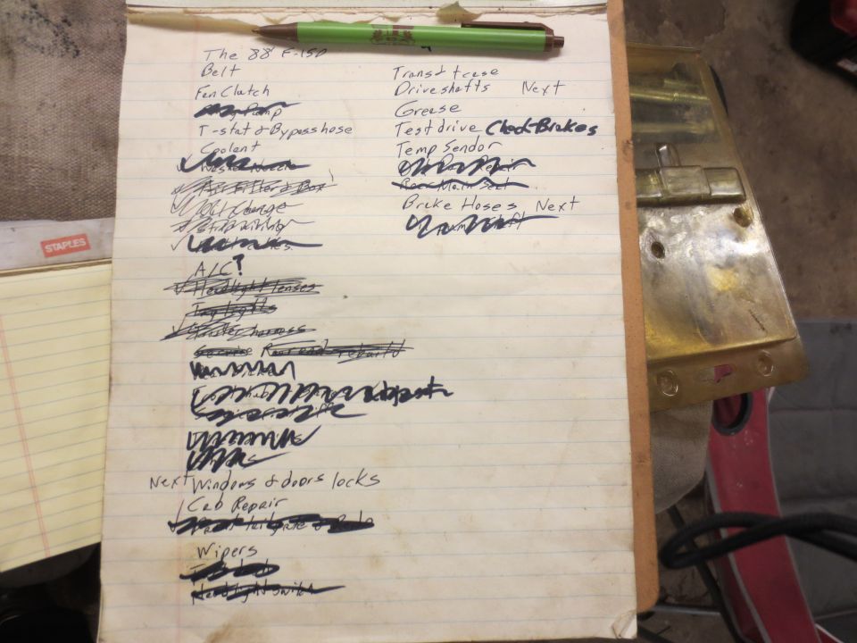 Handwritten to-do list on lined paper with automotive repair items.