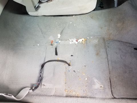 2004 Ford Crown Victoria - There was a roll of Life Savers in the seat base that I couldn't reach to remove, so I had to pull the chair.