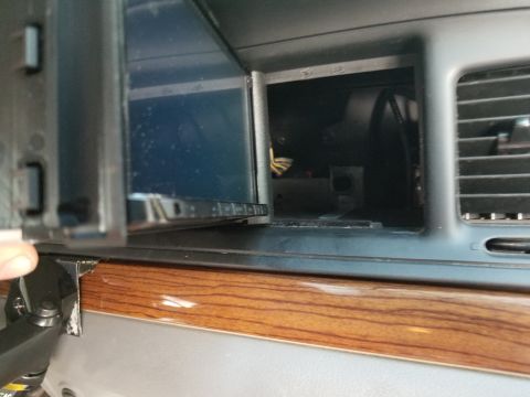 2004 Ford Crown Victoria - Because Ford didn't actually follow the DDIN specs on these radios, the bezel plastic has to be trimmed to fit an aftermarket DDIN chassis.
