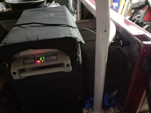 1968 Ford Bronco - A portable cooler with a digital temperature display showing 37 degrees is covered by a black insulated bag. The cooler is situated inside…
