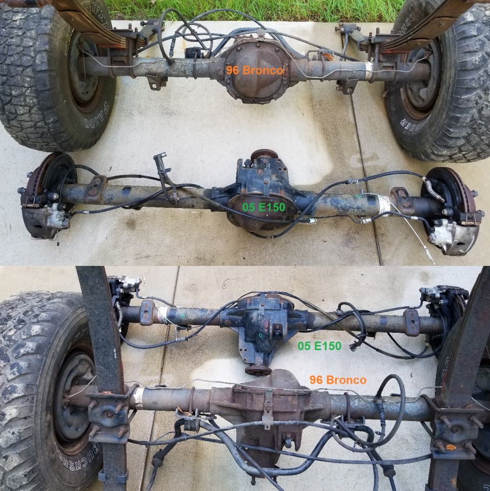 Side-by-side comparison of 96 Bronco and 05 E150 rear axles on concrete