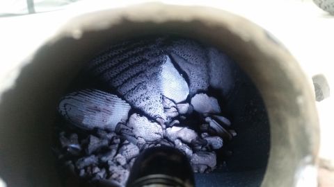 1985 Ford Bronco - A close-up view inside a catalytic converter shows a honeycomb ceramic structure that has broken into pieces. The pieces are dark gray and…