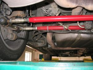 1993 Ford Taurus - Close-up view of the undercarriage, highlighting suspension and exhaust parts.