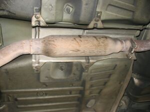1993 Ford Taurus - Underside view of a vehicle's exhaust system, showing a section of the pipe and converter.