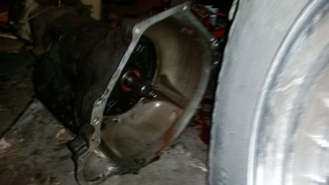 1985 Ford Bronco - A transmission bell housing is shown, with the torque converter clearly visible within its cavity.