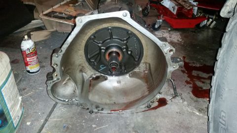 1985 Ford Bronco - Close-up of a transmission bell housing, likely removed for repair or replacement.