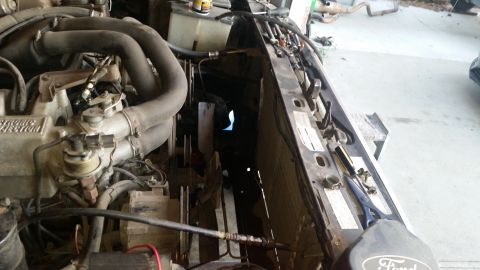 1985 Ford Bronco - Close-up view of the engine bay, focusing on the radiator and fan assembly.