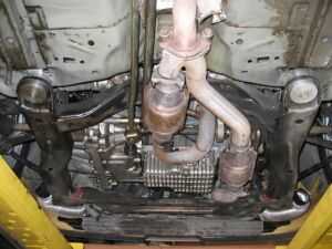 1993 Ford Taurus - A view of the underside of a vehicle, highlighting the exhaust system and transmission.