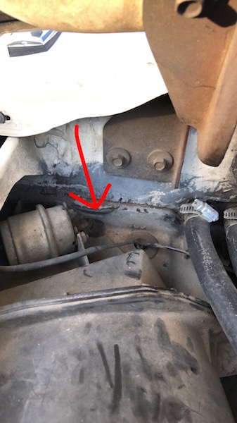 1981 Ford Bronco - Detail of engine bay components, with a red arrow indicating a specific area of interest.