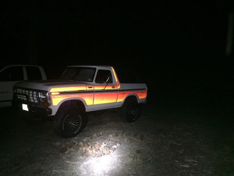 1979 Ford Bronco - This 1979 Ford Bronco is seen at night with its reflective stripes illuminated.