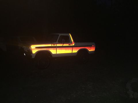 1979 Ford Bronco - Reflective stripe package on a 1978 Ford Bronco glows at night.