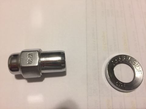 1979 Ford Bronco - A chrome lug nut and a washer are shown, with visible markings indicating their specifications.