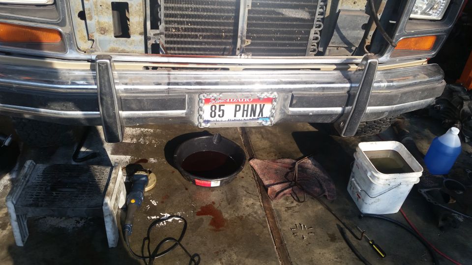 1985 Ford Bronco front bumper with oil drain pan and bucket