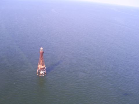 1992 Ford Bronco - A lighthouse stands alone in the vast expanse of the ocean.