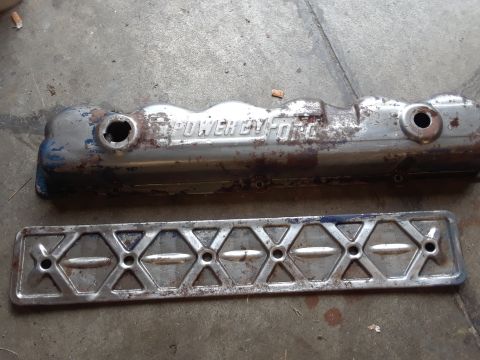 1985 Ford Bronco - A worn engine valve cover and gasket are shown, with visible rust and faded chrome.