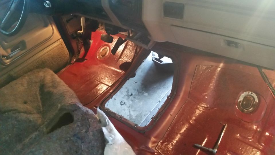 Interior floor with large opening and red carpeting