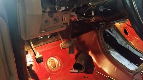 1985 Ford Bronco - The interior of a vehicle is shown, focusing on the driver's side footwell and dashboard components.