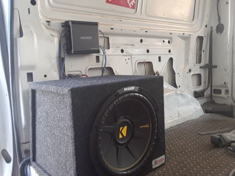 1999 Ford E250 - Kicker subwoofer and amplifier installed in the rear of a van.