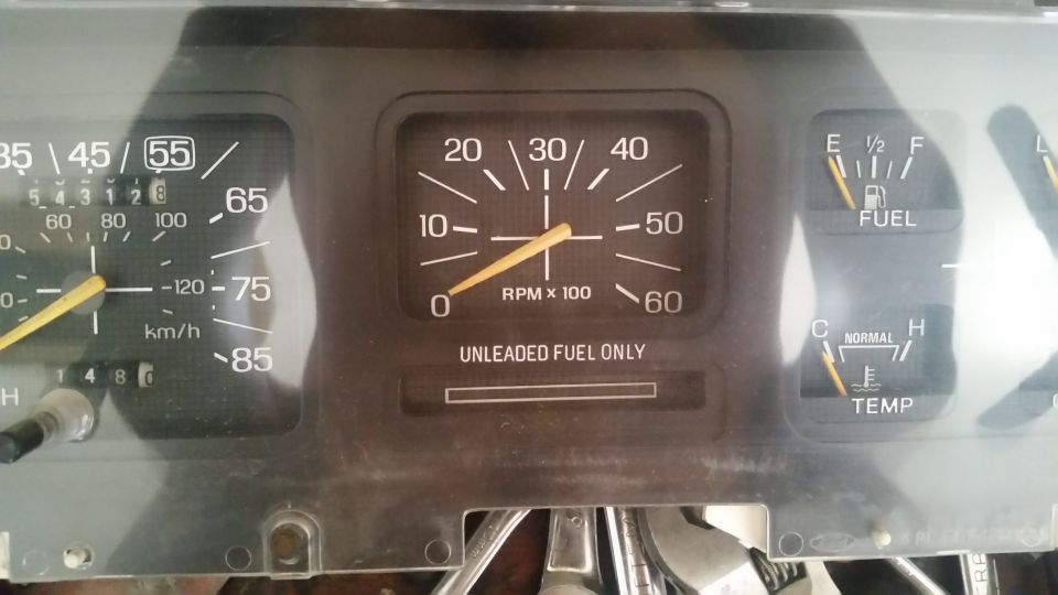 1985 Ford Bronco dashboard gauges with speedometer, tachometer, fuel, and temp