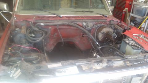 1985 Ford Bronco - Engine bay of a 1985 Ford Bronco, engine has been removed for work.