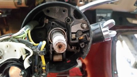 1985 Ford Bronco - Close-up view of the steering column's internal components, showing wiring and mechanical parts.