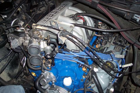 1995 Ford Bronco - Close-up view of an engine bay, showing various components and wiring.
