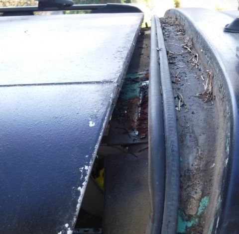 1992 Ford Bronco - The depth beyond the main weatherstrip on the very dirty rain rail, for determining clearance of the bolts so they don't damage the weather…